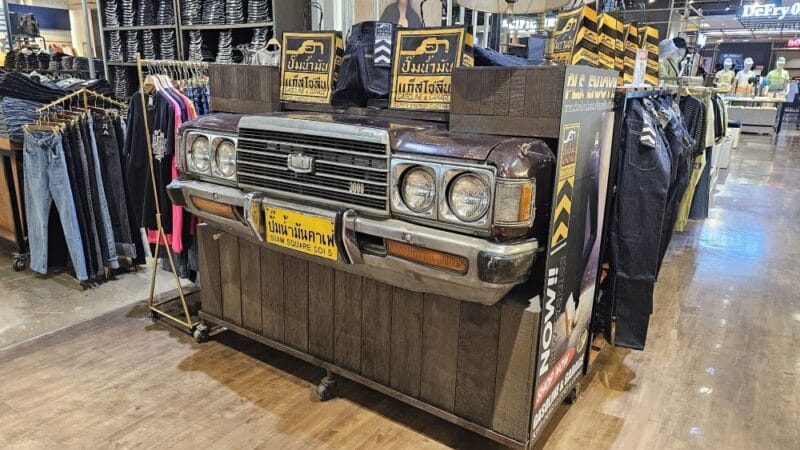 Clothes shop display using the front end of an old Toyota Crown.